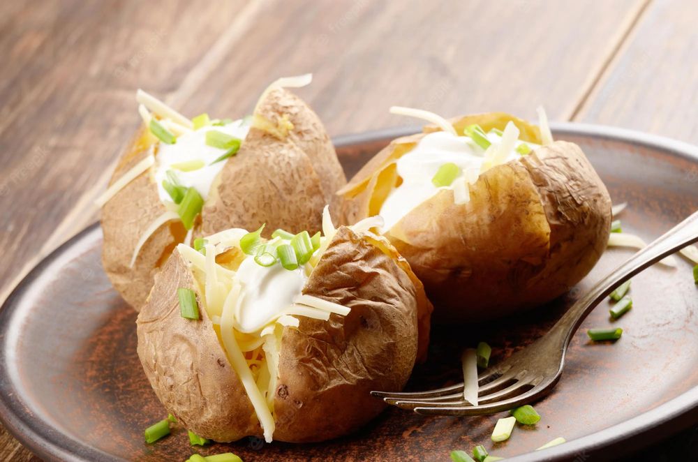 Baked potatoes topped with cheese and chives at The Balgarth Pines